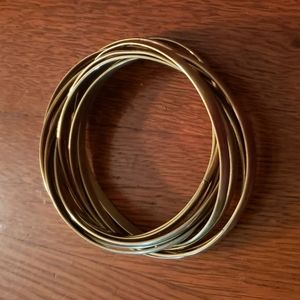 12 brass bangles - all intertwined as one big bangle